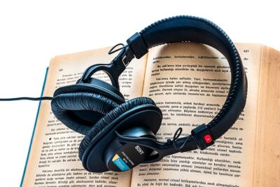 Audio book - hardback book with headphones on top